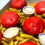 Wulf Burger Dallas serves bold red bun smashburgers & beef-tallow fries at Mockingbird Station