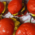 The Wulf Special Burger — red bun Halal beef burger with garlic mustard aioli at Wulf Burger McKinney.