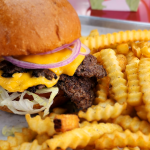 Best cheeseburger in Dallas TX at Wulf Burger with red beet bun and melted cheese