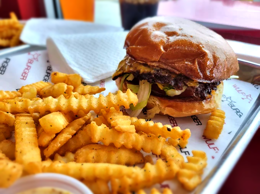 Wulf Burger smash burger with red bun in Dallas