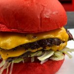 Loaded double smash burger with melted cheese at Wulf Burger Dallas TX