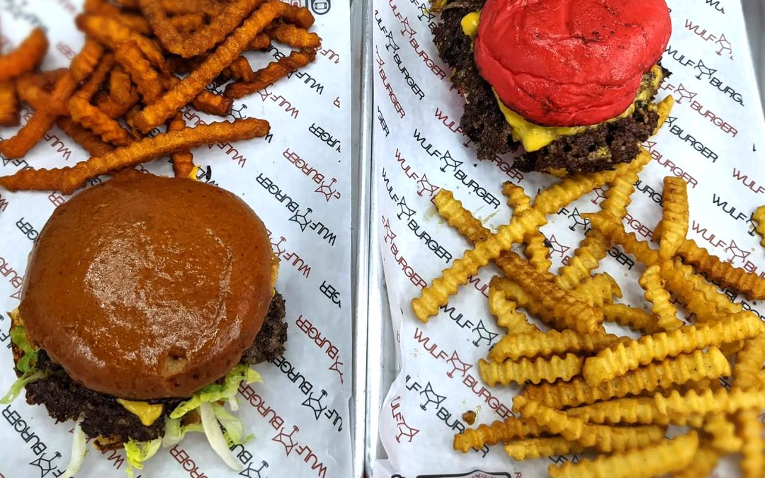 Diverse top-tier burgers at Wulf Burger in Dallas TX including protein stacks and classics