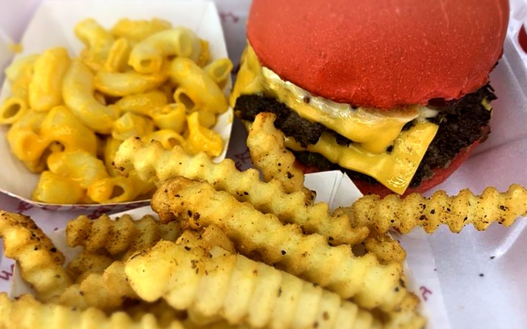 Crispy double smash burger with melted cheese at Wulf Burger Dallas TX