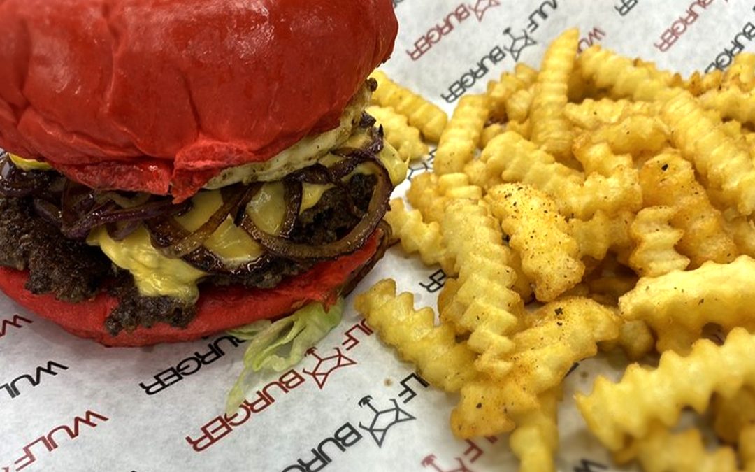 Loaded double cheese burger at Wulf Burger Dallas TX with fresh toppings and premium beef patties