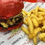 Loaded double cheese burger at Wulf Burger Dallas TX with fresh toppings and premium beef patties