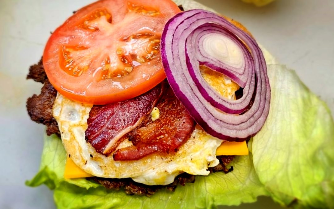 High-protein double smash burger with beef bacon and fried egg at Wulf Burger Dallas TX