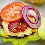 High-protein double smash burger with beef bacon and fried egg at Wulf Burger Dallas TX