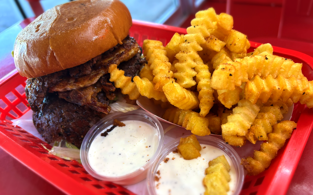 Wulf Burger double cheese burger showcasing traditional American style with modern innovation in Dallas Texas