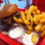 Wulf Burger double cheese burger showcasing traditional American style with modern innovation in Dallas Texas