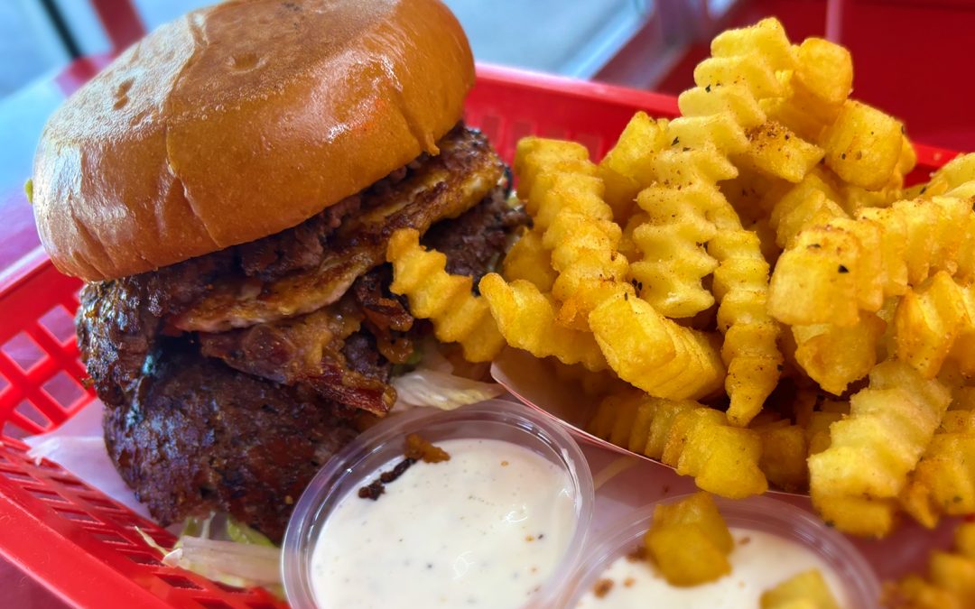 Wulf Burger double smash burger with melted cheese in Dallas Texas