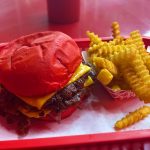 Wulf Burger double smash burger with red bun near Plano and Frisco Texas